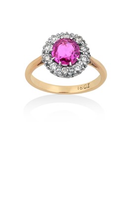 Lot 2101 - A Pink Sapphire and Diamond Cluster Ring the...