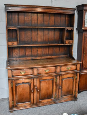 Lot 1312 - A 20th Century Oak Dresser And Rack, 139cm by...