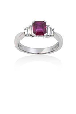 Lot 2162 - A Ruby and Diamond Ring the emerald-cut ruby...
