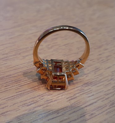 Lot 2026 - An 18 Carat Gold Orange Topaz and Diamond Ring...