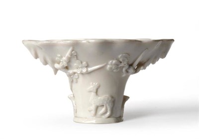 Lot 146 - A Chinese Blanc de Chine Libation Cup, 17th/18th century, of typical form, moulded and applied with