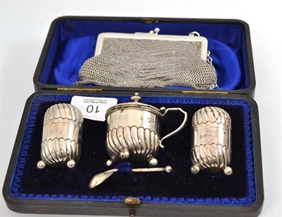 Lot 10 - A silver three piece cruet, London 1901 and a silver mesh purse, worn marks