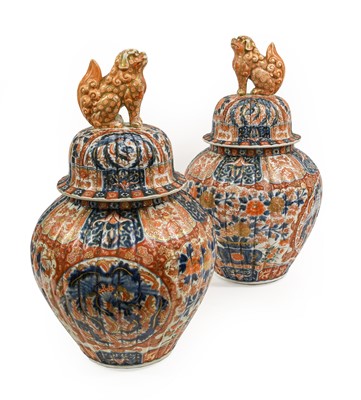 Lot 135 - A Pair of Imari Porcelain Jars and Covers,...