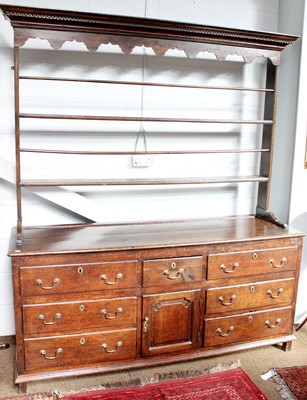 Lot 688 - A Mid 18th Century Enclosed Oak Dresser and...