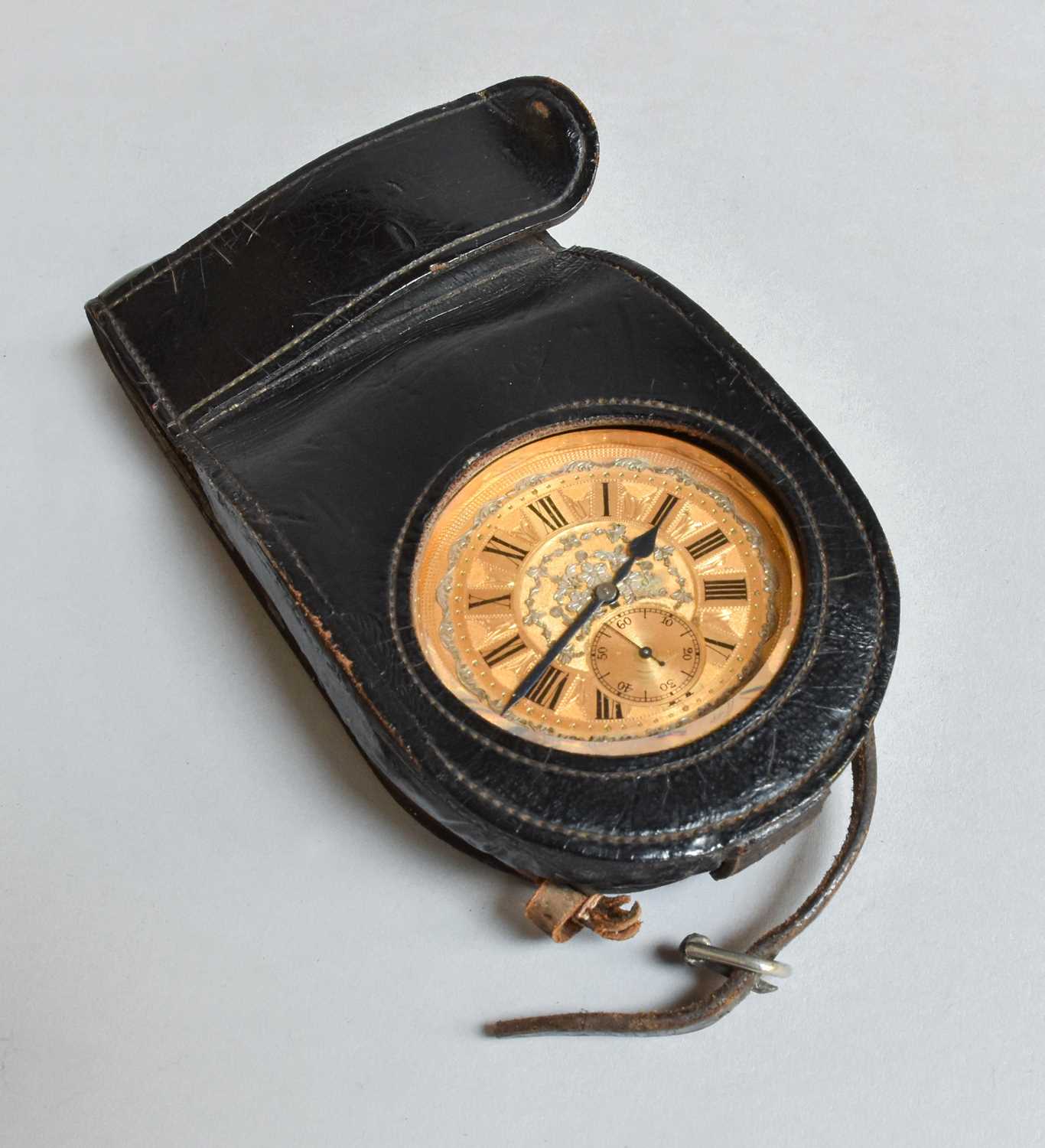 Lot 327 - A Swiss Travel Clock, in original leather case