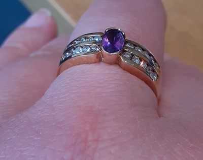 Lot 2030 - An Amethyst and Diamond Ring the oval cut...