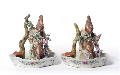 Lot 155 - A Rare Pair of Chinese Porcelain Bird Groups, Qianlong, as two birds perched on a stone wall beside