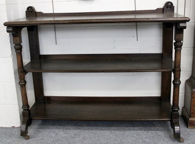 Lot 1415 - A Carved Oak Three Tier Buffet, on turned...