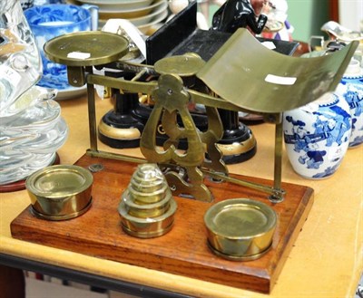 Lot 46 - Brass postal scales on an oak plinth base; and another G.P.O Baker & Walsh Ltd Hounslow scales