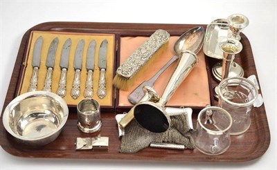 Lot 57 - A collection of silver including two vases, six tea knives, clothes brush, Indian silver bowl...