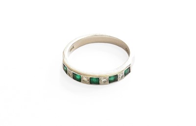 Lot 24 - An Emerald and Diamond Half Hoop Ring, stamped...