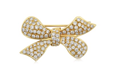 Lot 2245 - A Diamond Brooch the stylised bow motif set...