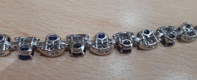 Lot 2235 - A Sapphire and Diamond Bracelet twenty oval...