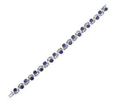 Lot 2235 - A Sapphire and Diamond Bracelet twenty oval...