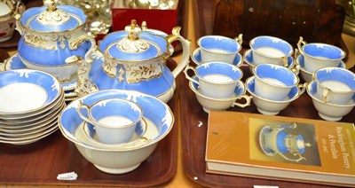 Lot 71 - A Rockingham blue and gilt decorated tea service and one volume of Rockingham pottery