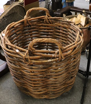 Lot 1083 - A substantial wicker log basket, 75cm dia.