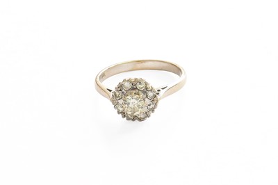 Lot 46 - A Diamond Cluster Ring, the central raised...