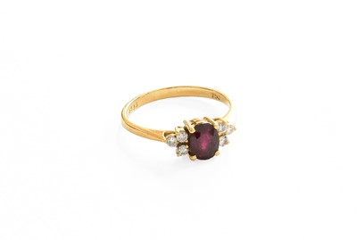 Lot 37 - A Ruby and Diamond Ring, the oval cut ruby...