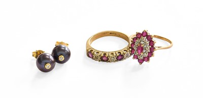Lot 33 - A 9 Carat Gold Ruby and Diamond Cluster Ring,...
