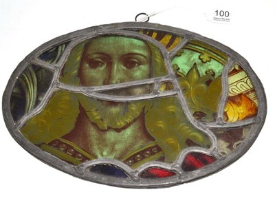 Lot 100 - Oval painted stained glass panel depicting Christ