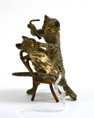 Lot 101 - A novelty cold painted bronze modelled as two cats, one receiving a wet shave from the other