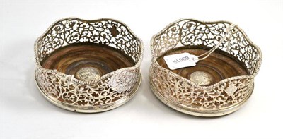 Lot 107 - A pair of silver coasters, marks worn, circa 1770