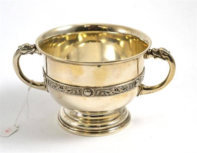 Lot 109 - A George V silver twin handled sugar bowl, London 1930, with a band of Celtic strapwork decoration