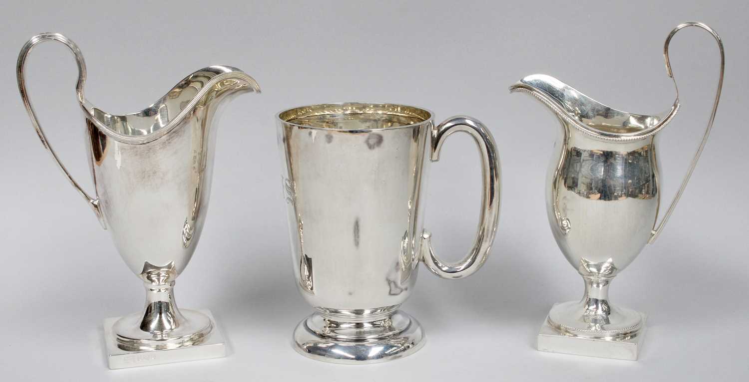 Lot 66 - A George V Silver Mug and Two Cream-Jugs, the...