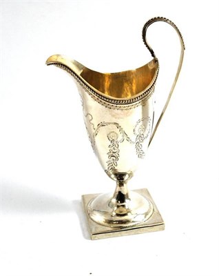 Lot 110 - A George III silver cream helmet, London 1787, of typical form with a square foot and beaded border