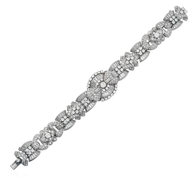 Lot 2311 - A Diamond Bracelet set throughout with round...