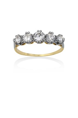 Lot 2184 - A Diamond Five Stone Ring the graduated round...