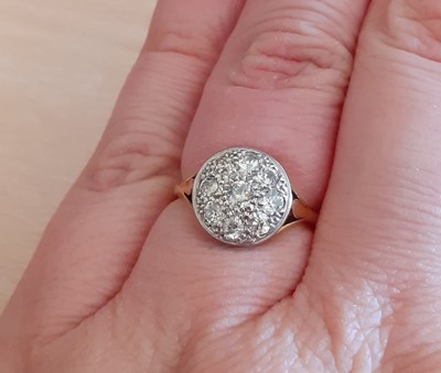 Lot 2083 - A Diamond Cluster Ring the circular plaque set...