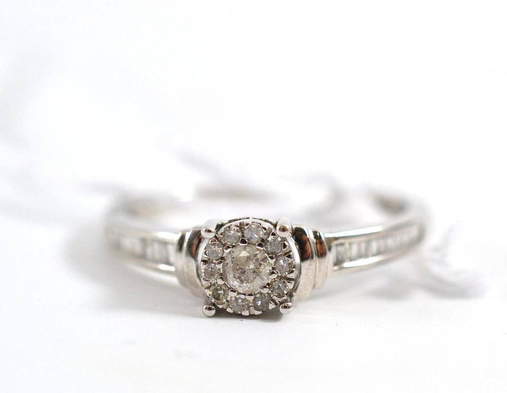 Lot 128 - A 9ct white gold diamond dress ring