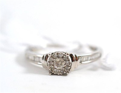 Lot 128 - A 9ct white gold diamond dress ring
