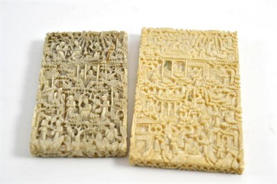 Lot 133 - A 19th century Cantonese carved ivory card case, each side carved in relief with figure amongst and