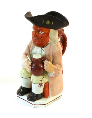 Lot 71 - A Pearlware Red Faced Toby Jug, 19th century,...
