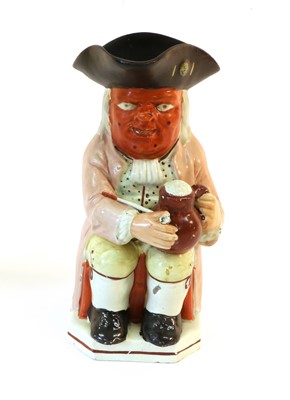 Lot 71 - A Pearlware Red Faced Toby Jug, 19th century,...