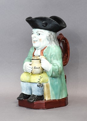 Lot 73 - A Pearlware Toby Jug, early 19th century,...