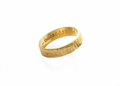 Lot 59 - An 18 Carat Gold Textured Band Ring, finger...