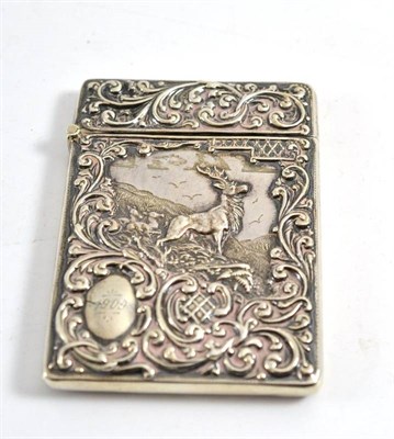 Lot 141 - A Victorian silver card case, Chester 1903 with embossed decoration of a stag