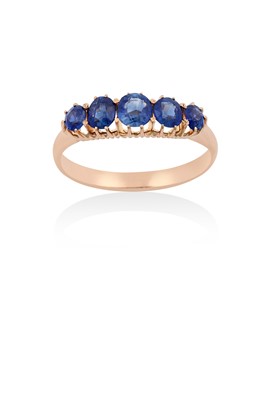 Lot 2136 - A Sapphire Five Stone Ring the graduated oval...