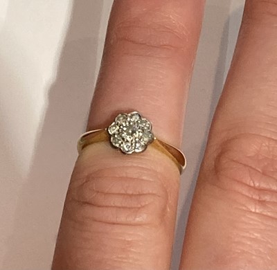 Lot 56 - A Diamond Cluster Ring, stamped '18CT', finger...