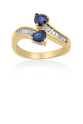 Lot 2200 - A Sapphire and Diamond Twist Ring the yellow...