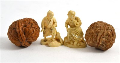 Lot 155 - A pair of Japanese ivory Okimono of fisherman and a pair of carved walnuts (4)