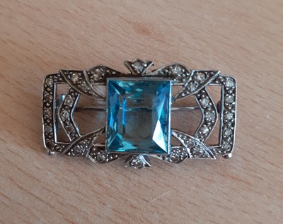 Lot 2019 - An Aquamarine and Diamond Brooch the fancy cut...