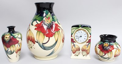 Lot 230 - Modern Moorcroft Pottery, three vases and a...