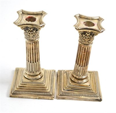 Lot 166 - Pair of silver candlesticks