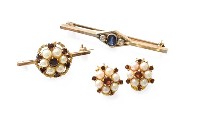 Lot 342 - A Sapphire and Diamond Bar Brooch, an oval cut...