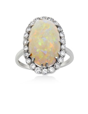 Lot 2290 - An Opal and Diamond Cluster Ring the oval...