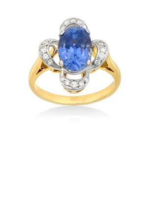 Lot 2310 - A Sapphire and Diamond Cluster Ring the oval...